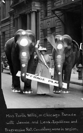 two elephants holding board labeled 'Suffrage Plank' 
